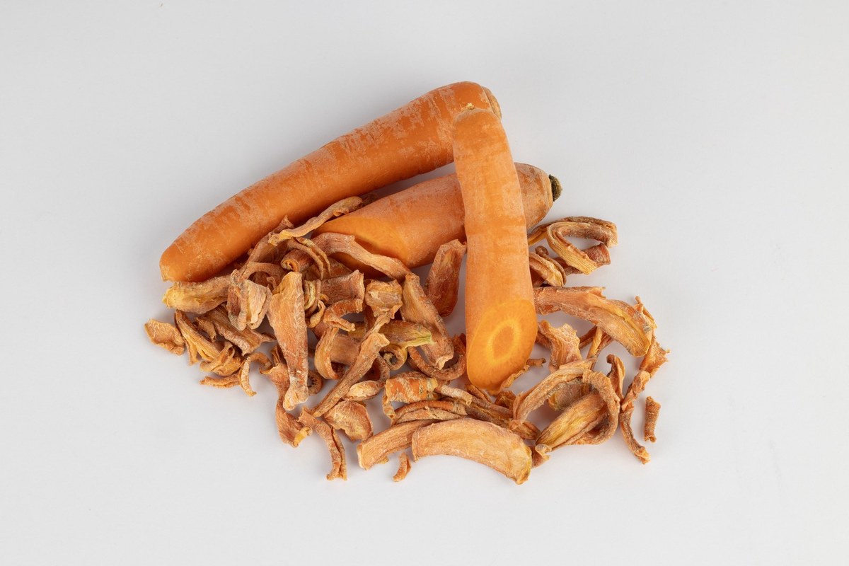 Fresh and dried carrot, studio black background