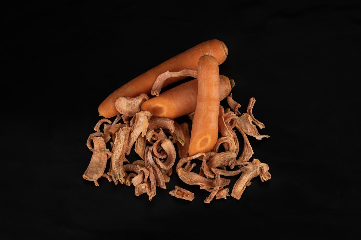 Fresh and dried carrot, studio black background